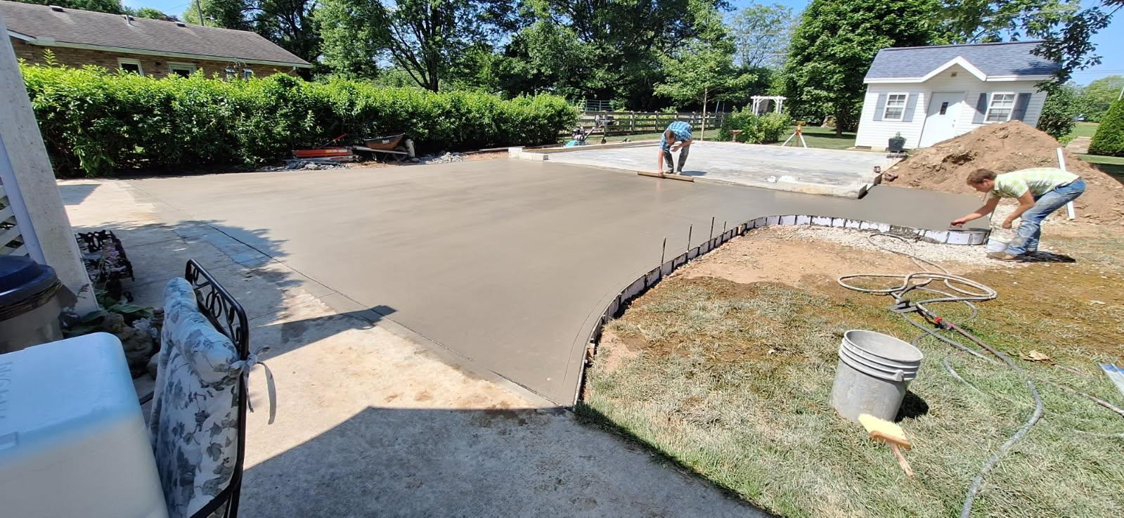 A concrete pour in progress in progress on a Hand Made Enterprises job site