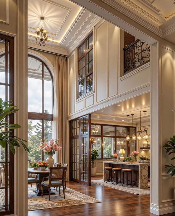 Great room arched window living space in a Hand Made Enterprises home