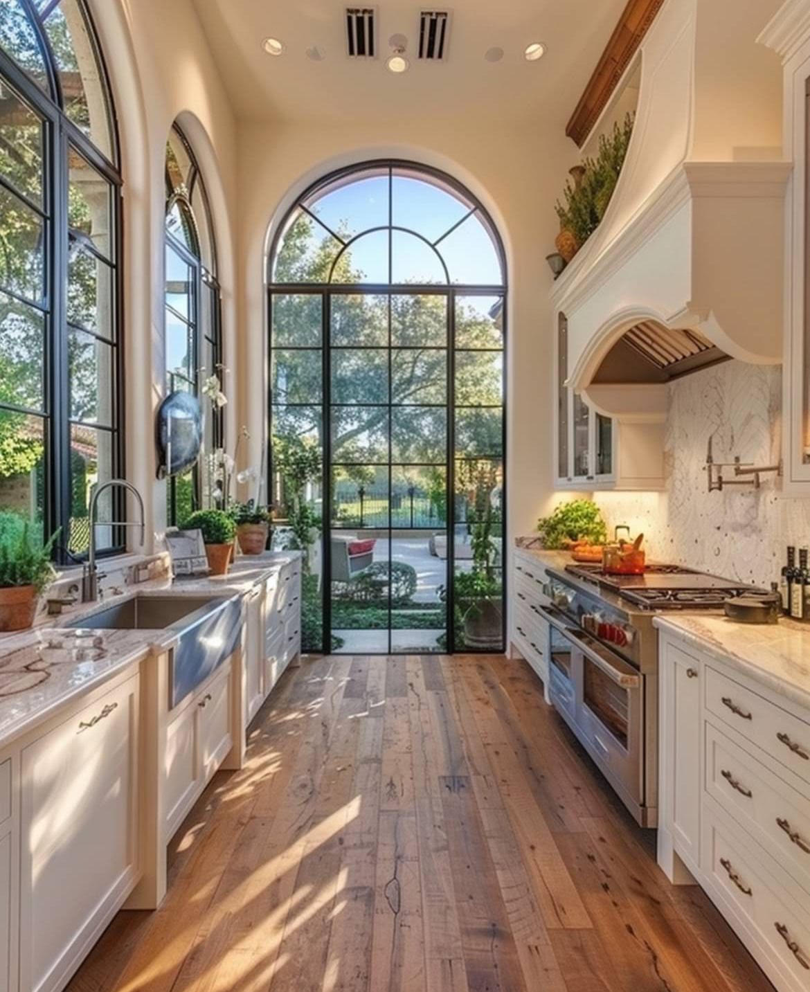 Arched window farmhouse sink kitchen in a Hand Made Enterprises build