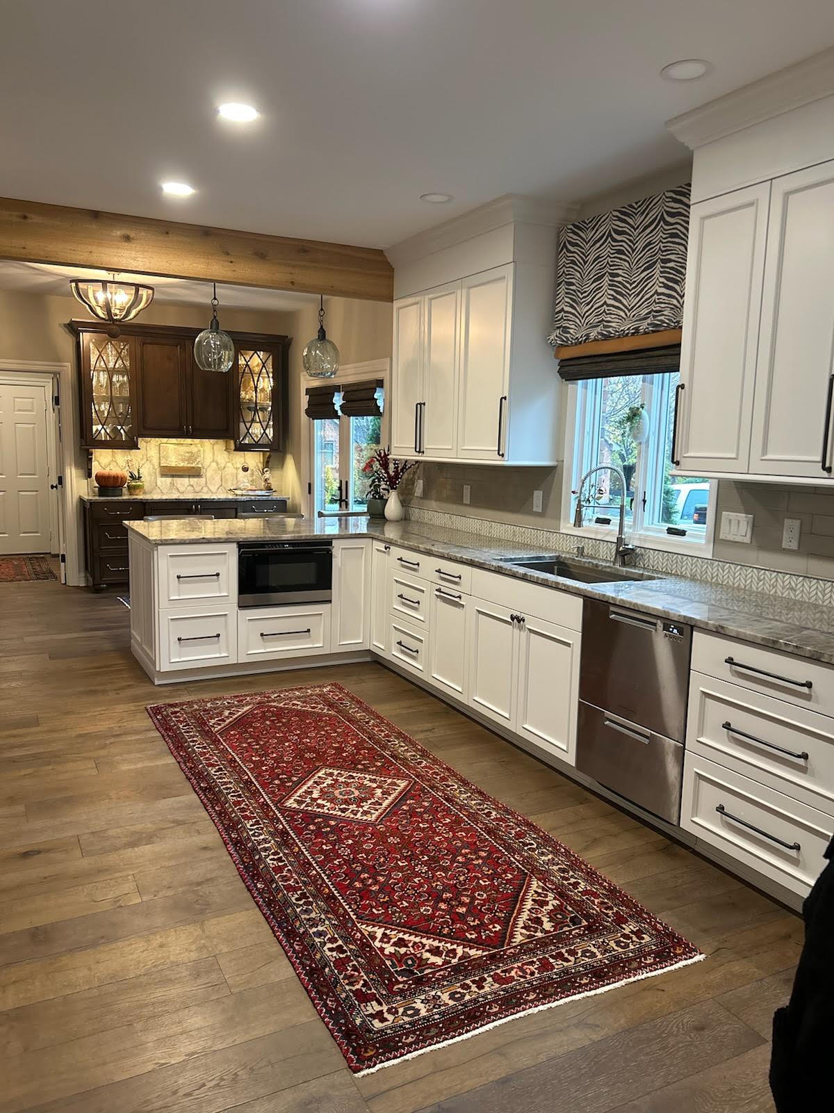 Kitchen built by Hand Made Enterprises, white galley wood floor
