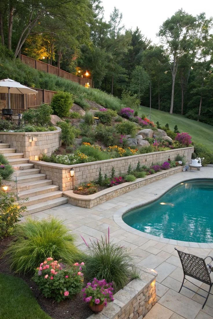 A pool below tiered stone retaining walls and steps