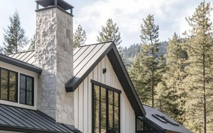 Dark standing seam metal roof with raised seams and no exposed fasteners in the panel field